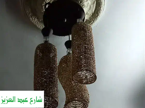 ثلاثية الأضواء الساحرة: نجفة نيكل ذهبية فاخرة بـ 500 فقط!